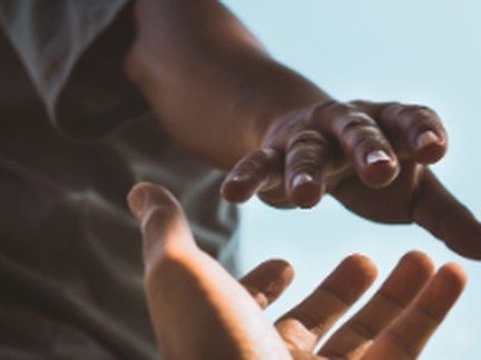One open hand reaching toward another